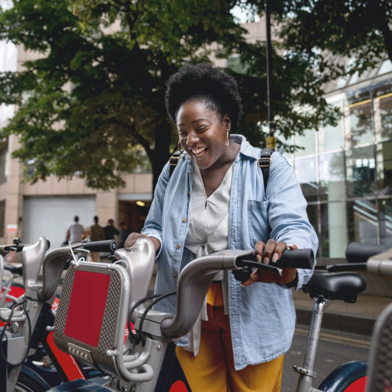 Woman booking a Santander hire bike