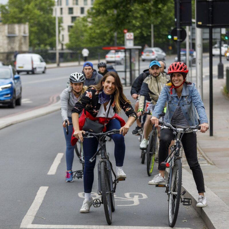 People on cycle lane (cycle superhighway) smiling