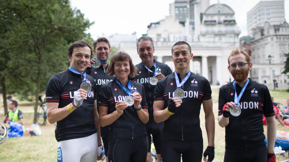 Six cyclists in LCC kit showing off their medals after a Challenge Event.