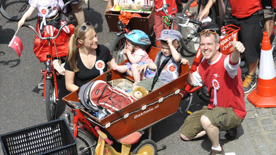 Children and parents as a family with a cargo bike at LCC event