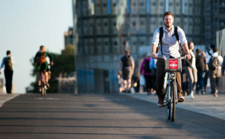 Man on Santander bike on cycle lane (cycle superhighway)