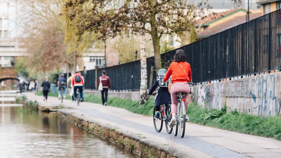 Mother and child cycling along the canal