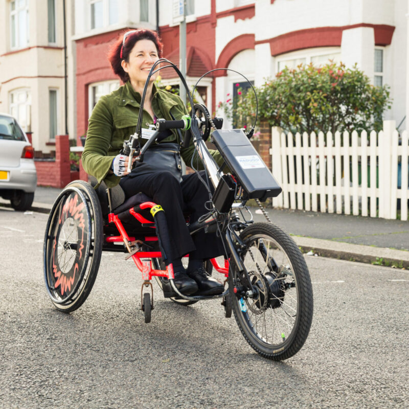 Wheels for wellbeing people on adapted cycles - woman on hand cycle