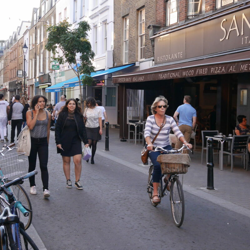 Woman cycling on Low Traffic Neighbourhood (LTN) High Street