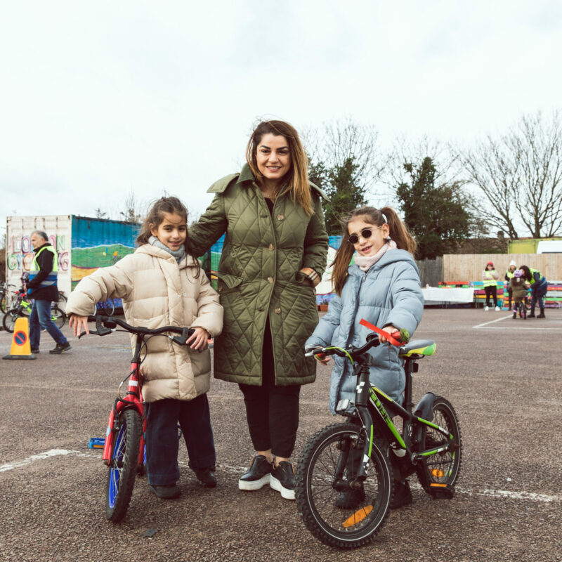LBK woman with children and bikes