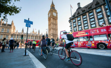 Westminster cycle lane (cycle superhighway) with woman cycling and bus
