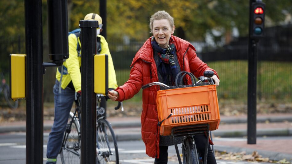 Woman with Dutch bike and basket on cycle lane C4