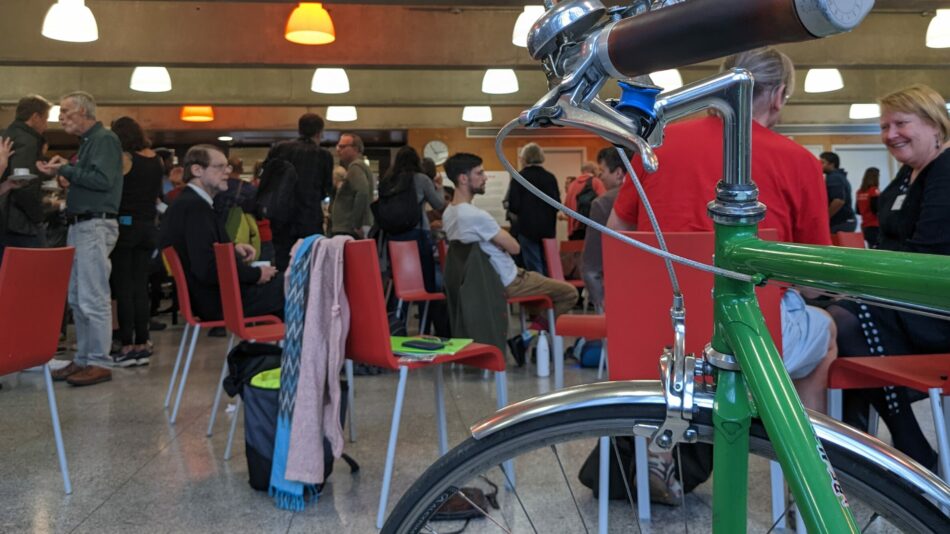 LCC AGM event with bike in foreground and people talking