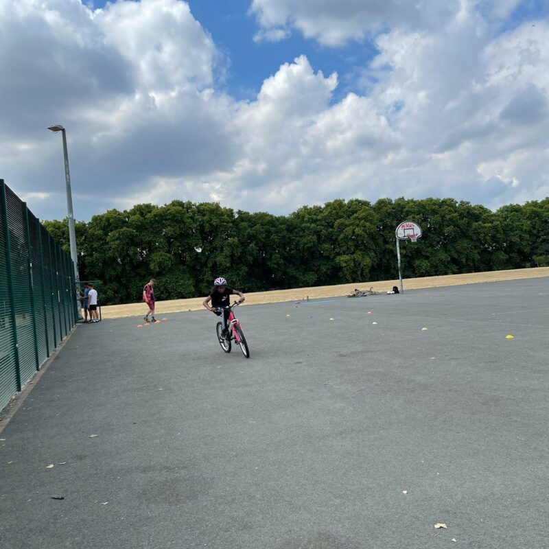Michael and Amira doing NHS cycle training - Amira cycling