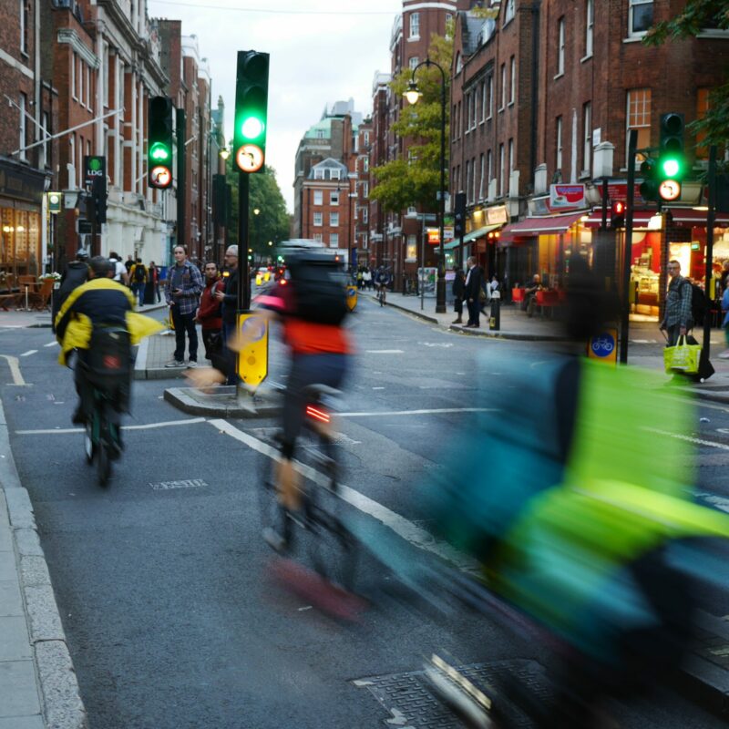 People cycling through cycle lane at junction