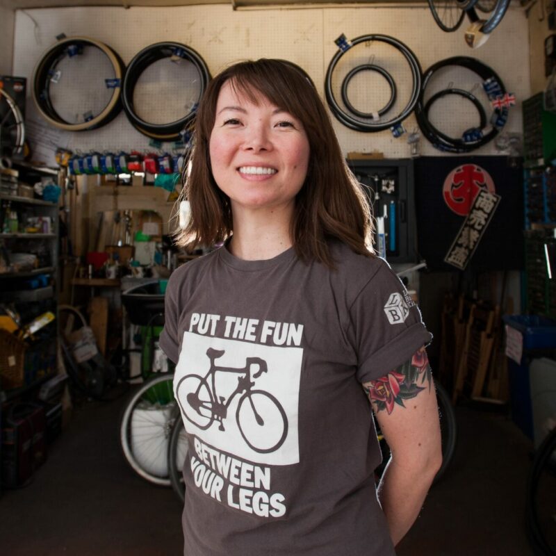 Bike Kitchen picture with woman bike mechanic (Jenny) in workshop
