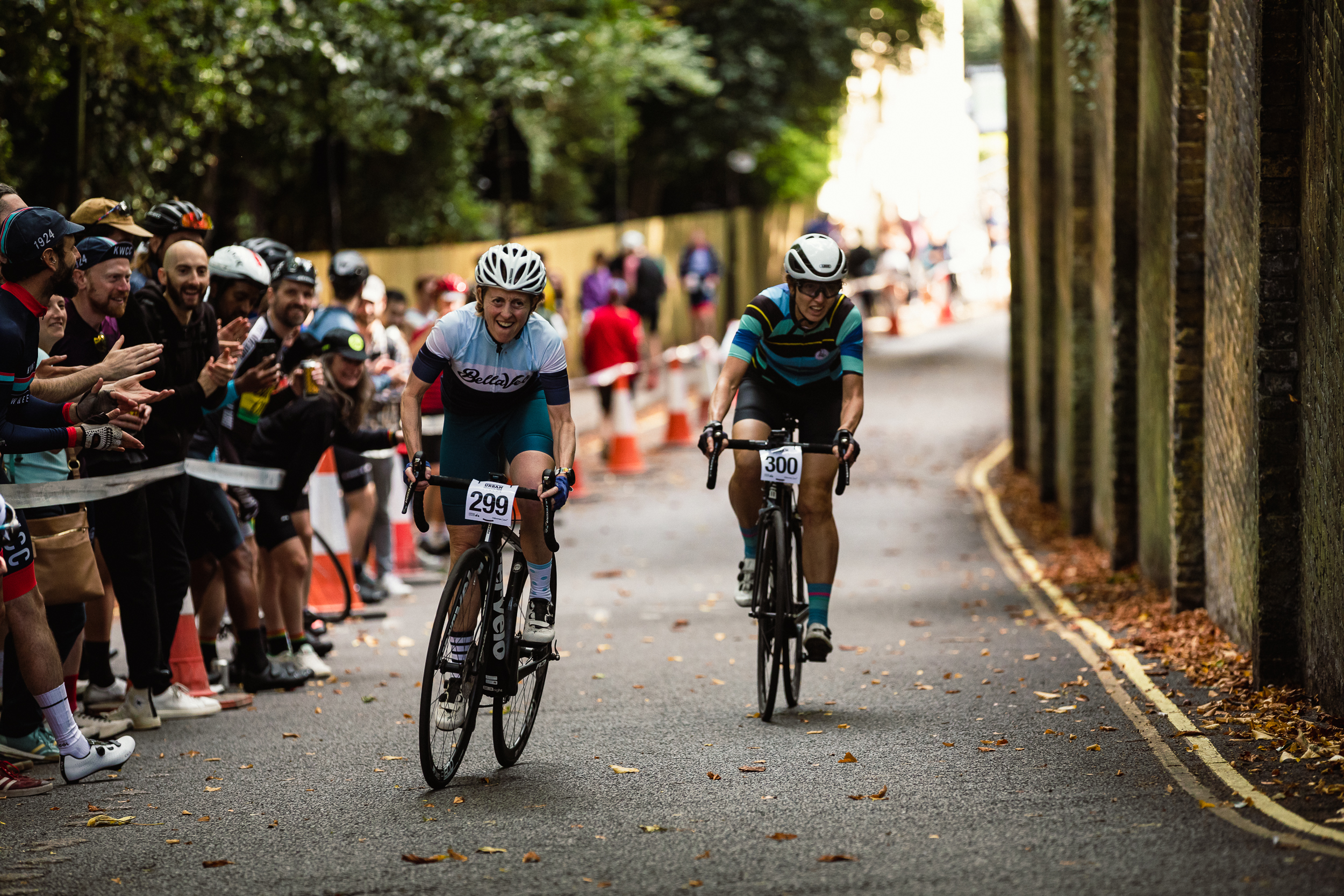 Woman racing up hill at Urban Hill Climb challenge event