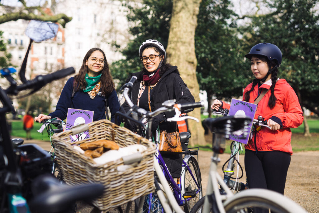 women assembling with their bikes before the start of a ride